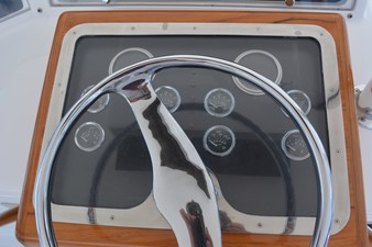 Reel Affair 44 teak helm bubble with manual gauges and single lever controls