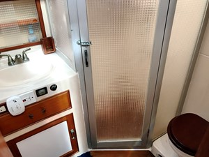 Knotned 58 shared port guest head with sink, commode, shower