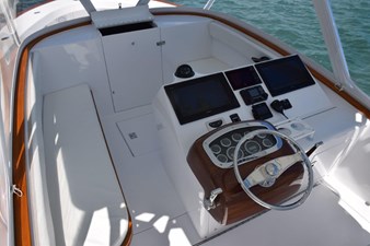 FARR GONE 15 Bridgedeck with varnished teak cap railing and seat trim