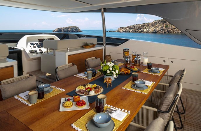 Upper deck dining table port view