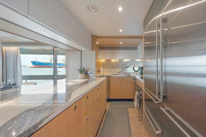 Galley Marble Counters and Stainless Fridge