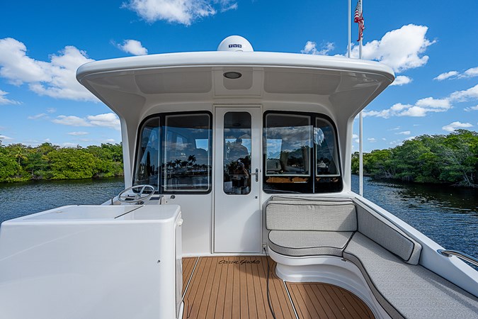 65_ocean_yacht_this_little_piggy_enclosed_flybridge_aft_deck_5
