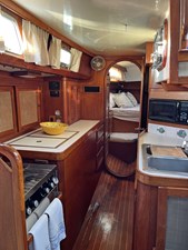 NEW HORIZONS 13 Galley from Salon toward Master Berth, Aft