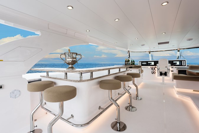 Open flybridge bar with bar stools. 