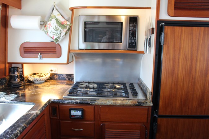 Gas range with convection/microwave above