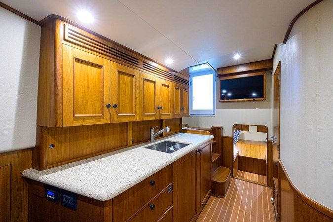 Galley looking aft, TV mounted above  