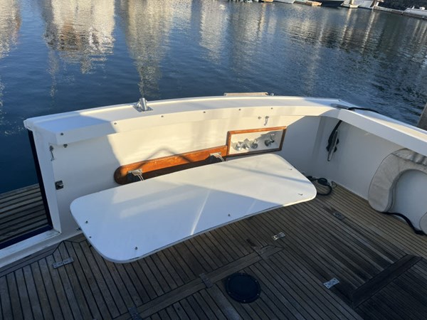 Fold-down aft seating