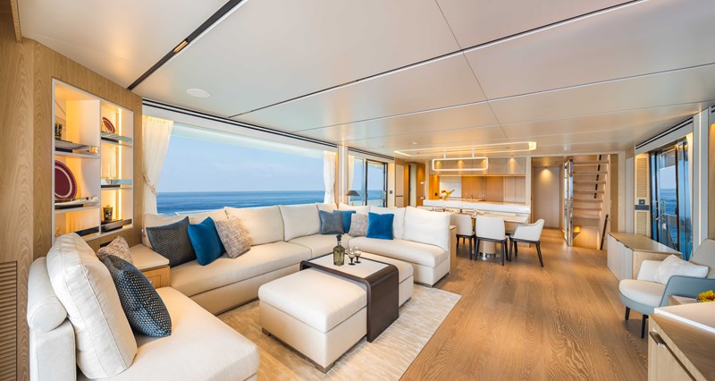 Horizon FD110 Hull 7 forward facing large salon with sofa and coffee table. 