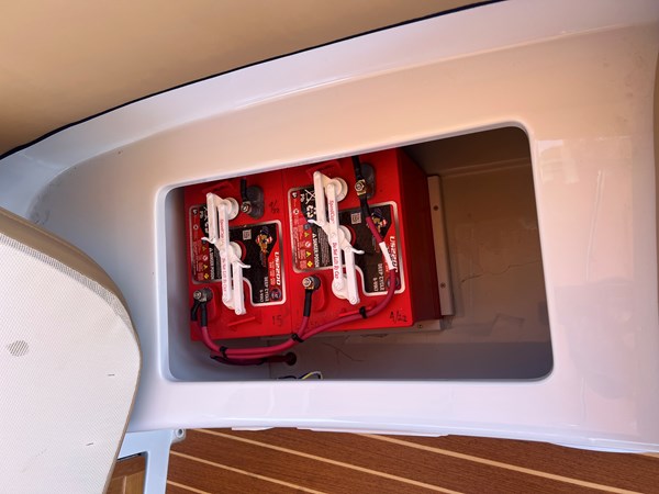 Starboard batteries under sit cushions