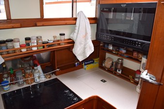 JAMIE LYN 23 1997 Grand Banks Classic yacht kitchen with spices, microwave, and countertop (1)