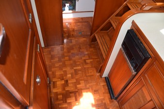 JAMIE LYN 25 Interior of 1997 Grand Banks Classic yacht with wooden flooring and cabinetry.