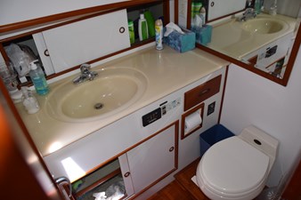 JAMIE LYN 31 Bathroom interior of 1997 Grand Banks Classic yacht with sink and toilet.