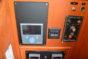 JAMIE LYN 45 Control panel of a 1997 Grand Banks Classic boat with windlass and display.