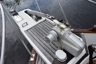 JAMIE LYN 60 1997 Grand Banks Classic yacht deck with anchor winch and wooden details.