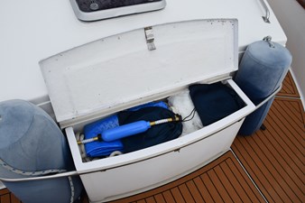 JAMIE LYN 62 Open storage compartment on 1997 Grand Banks Classic boat with marine equipment and accessories.