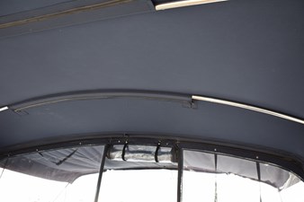 JAMIE LYN 74 Interior view of 1997 Grand Banks Classic boat canopy with metal support bars.