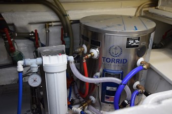 JAMIE LYN 81 Engine room of 1997 Grand Banks Classic with Torrid yacht water heater system.