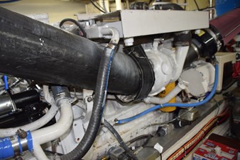 JAMIE LYN 87 Engine compartment of a 1997 Grand Banks Classic boat, showcasing hoses and mechanical components.