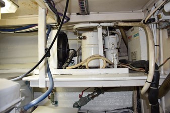 JAMIE LYN 93 Engine room of a 1997 Grand Banks Classic boat with visible machinery and wiring.