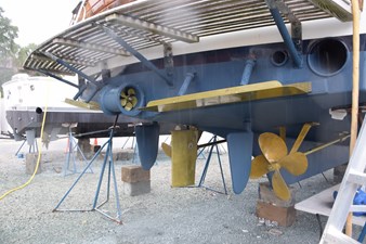 JAMIE LYN 95 1997 Grand Banks Classic yacht underbody with propellers and supports in dry dock.