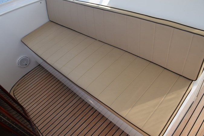 Companion bench seating forward of helm