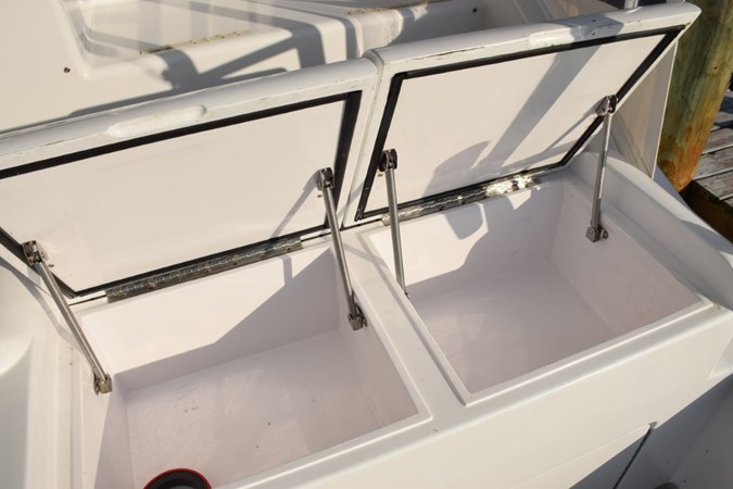 Storage boxes with gasketed tops in tackle center