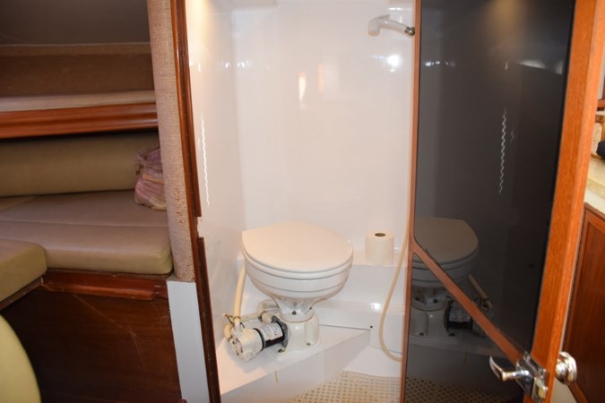 Electric head with shower wand and floor drain