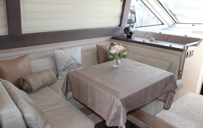 Interior view of salon on Monte Carlo, featuring comfortable seating area and a table