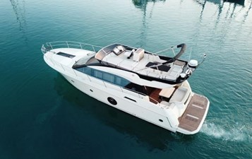 Monte Carlo 5 1 Exterior side view of Monte Carlo 5 slowly cruising on blue waters