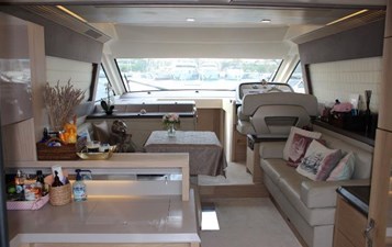 Monte Carlo 5 7 Interior view of salon on Monte Carlo, featuring comfortable seating area and a table