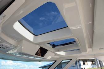 DIAMOND PEARL  7 Opening skylights overhead of helm. Engine data screen in overhead panel