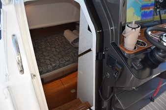 DIAMOND PEARL  16 Cabin interior entryway. Sliding hideaway, dark tinted, acrylic door. Vhf radio with external speaker