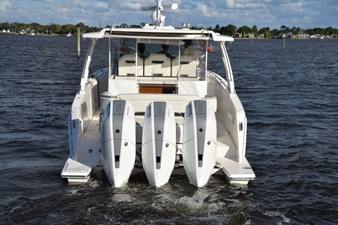 DIAMOND PEARL  39 Extended platforms outboard of motors - nice access. Indicator lights aft are on when engines are running. Swim ladder folds out on portsi