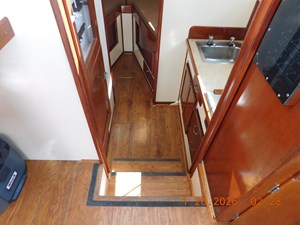 EAGLES NEST  13 Steps down to galley, head, and berth. Laminate wood flooring.