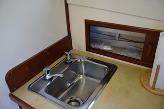 EAGLES NEST  19 Stainless sink and storage behind