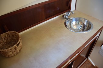 EAGLES NEST  32 Storage cabinet with sliding door behind countertop