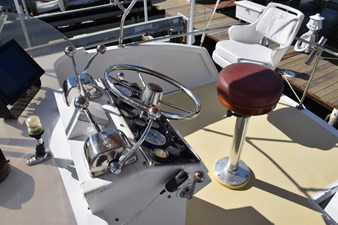 EAGLES NEST  44 Companion chair on flybridge behind helm