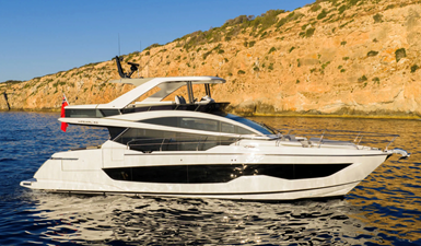 Pearl 63 1 • Spacious flybridge with lounge and dining areas