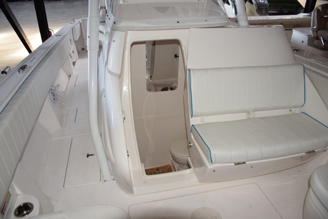 Console electrically slides open to head compartment.