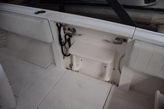 Fold-down transom door with stainless grab rails to sides of opening.