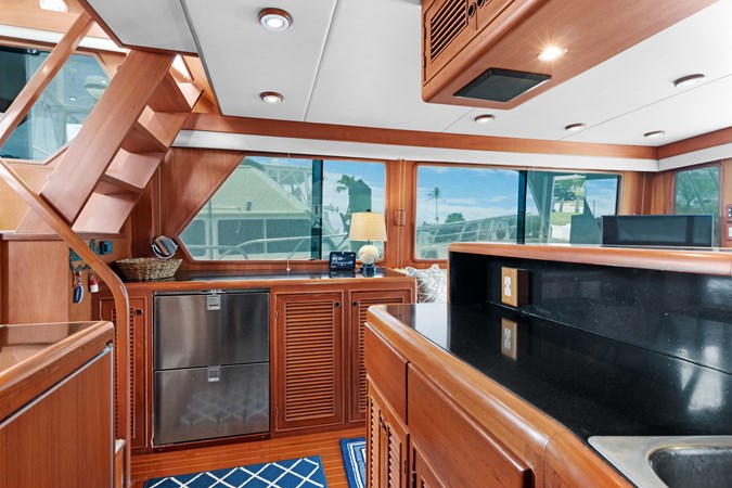 Galley countertop and drawer refrigeration in console across