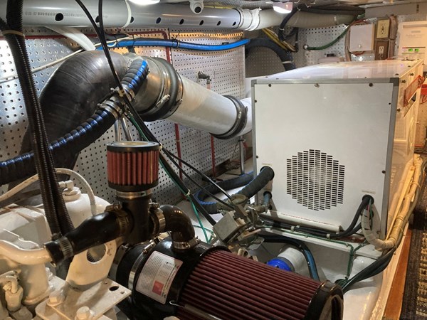 Aft of Starboard motor, note new exhaust riser, generator in sound shield box