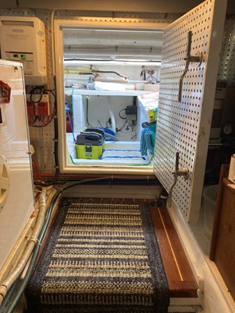 Aft engine room door open to Lazarette and cockpit deck hatch
