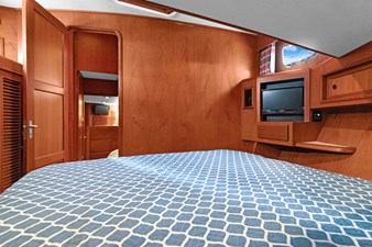 INDIGO 30 Guest stateroom aft view, entry door, TV