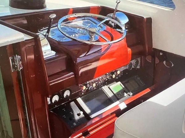 Electronics cabinet below helm