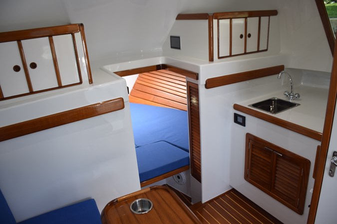 View from settee into berth and galley counter