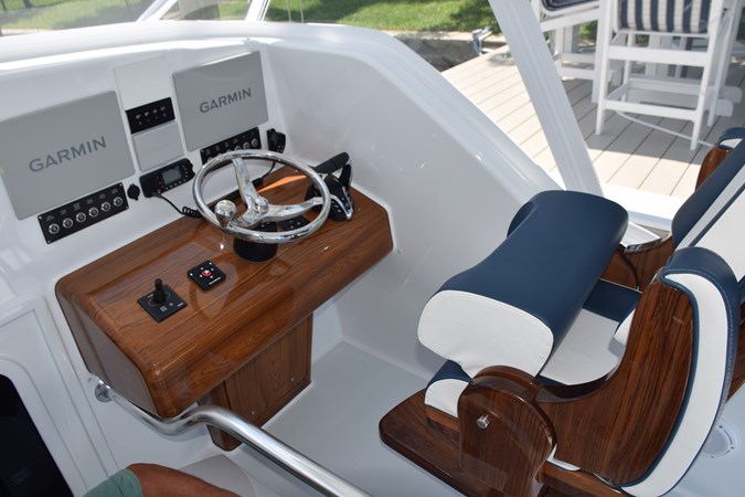 Helm console with seat bolster raised