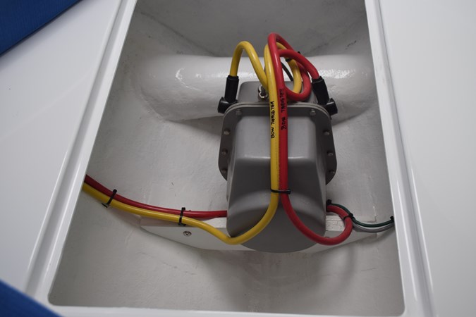 Bow thruster motor and tube in the forward bilge beneath berth