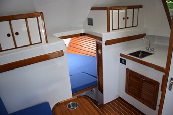 View from settee into berth and galley counter