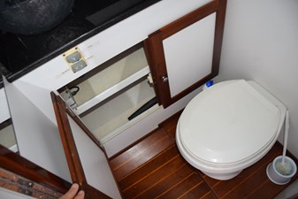 Freshwater electric head, storage beneath vanity